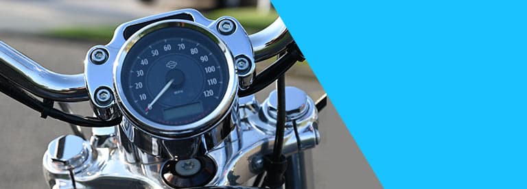 close up of motorcycle gauge cluster speedometer