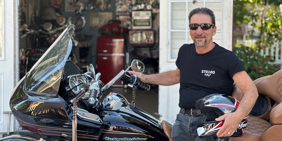 photo of a man sitting on a motorcycle